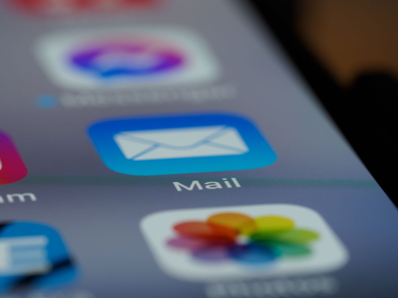 A detailed close-up of an email app icon displayed on a smartphone screen, highlighting contemporary technology.
